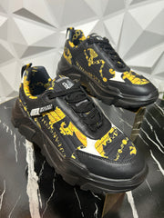 Designer black and gold sneakers