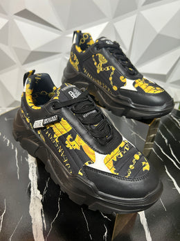 Designer black and gold sneakers